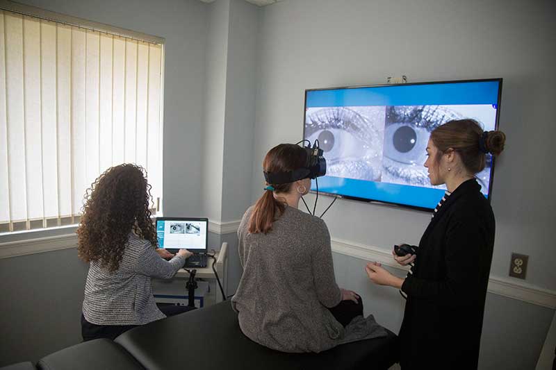 Dr. Sofia working with a patient at Hudson Valley Audiology